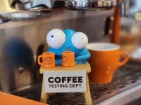 Coffee Testing Dept. creature vinyl figure set on espresso machine
