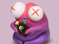 The Poison Testing Dept. vinyl figure sitting on floor